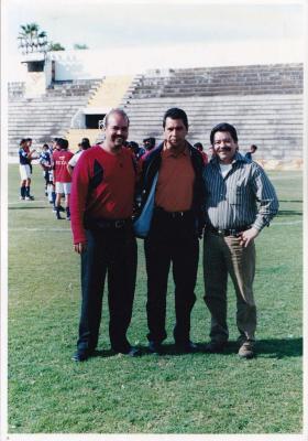 Tres hombres posan en el Estadio La Martinica  (Ca. 90's)